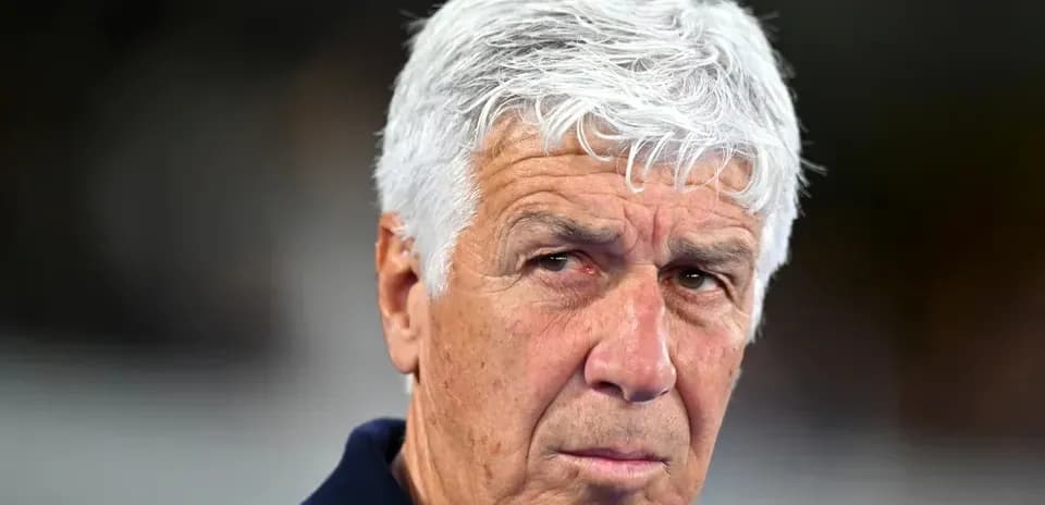 Coach with white hair during match preparation