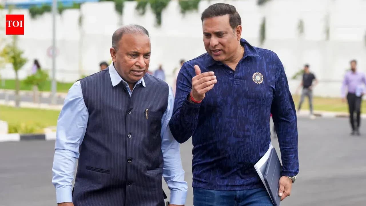Two men walking and discussing outdoors
