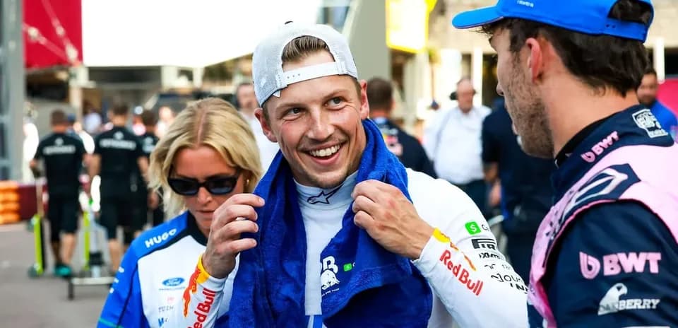 Two drivers chatting with a towel after race