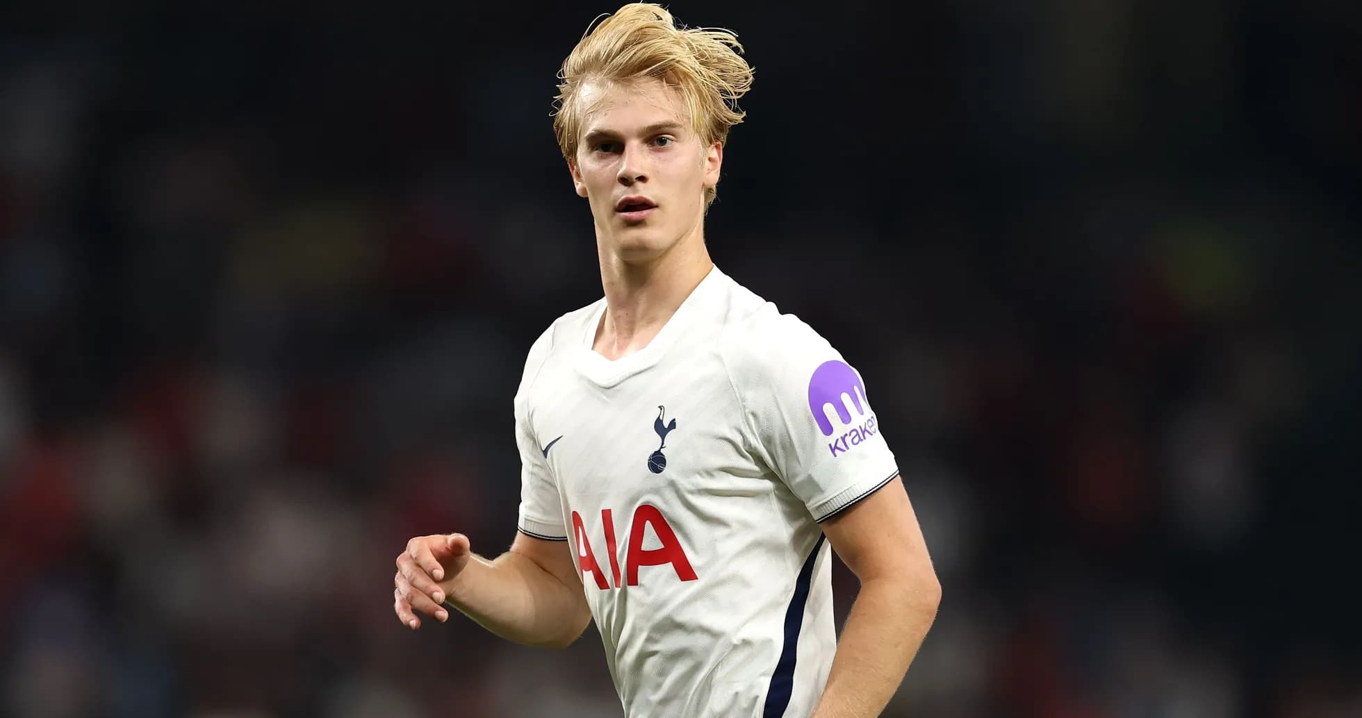 Player in Tottenham jersey running on the field
