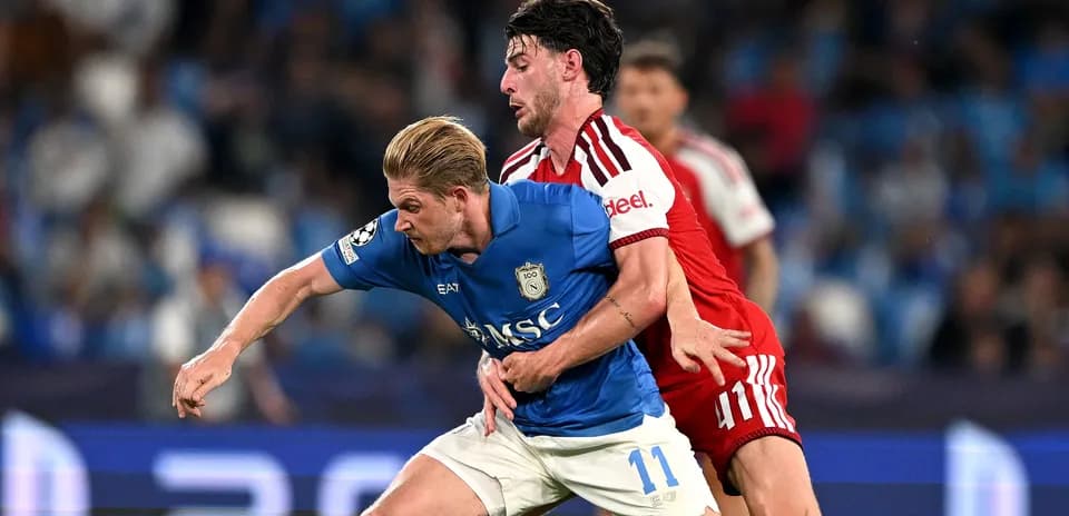 Two players battling for the ball during match