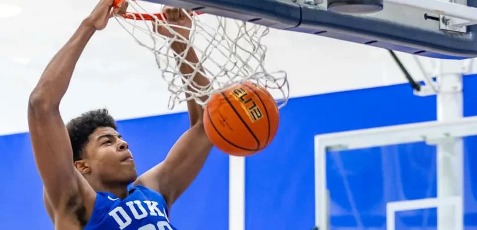 Player dunking a basketball into the hoop