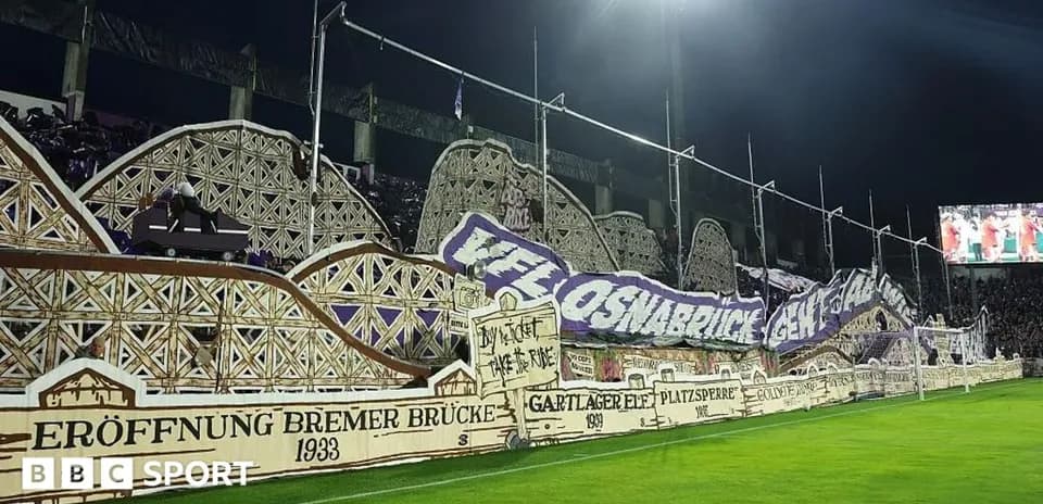 Fan banners displayed in stadium during match
