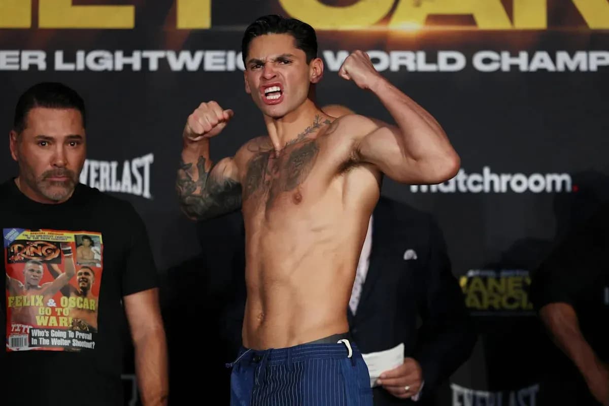 Fighter flexing muscles at weigh-in event