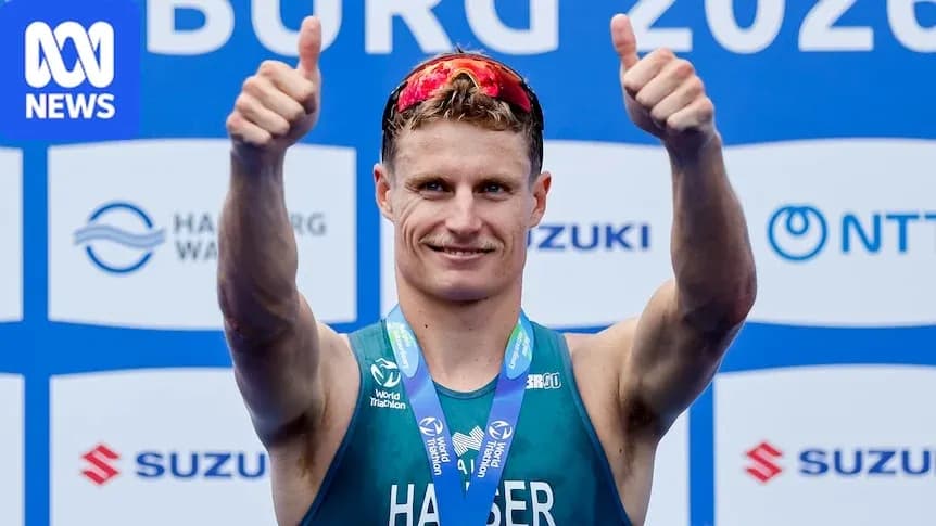 Athlete celebrating with thumbs up after competition