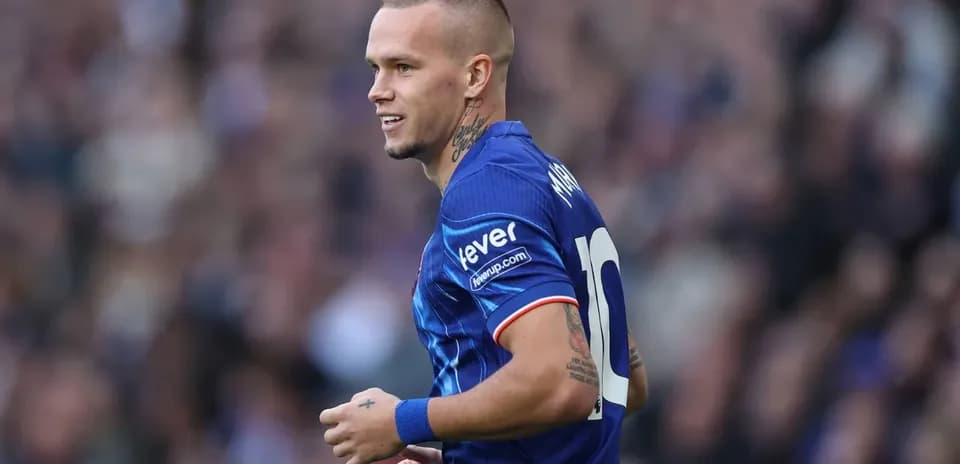 Player in blue kit during match action