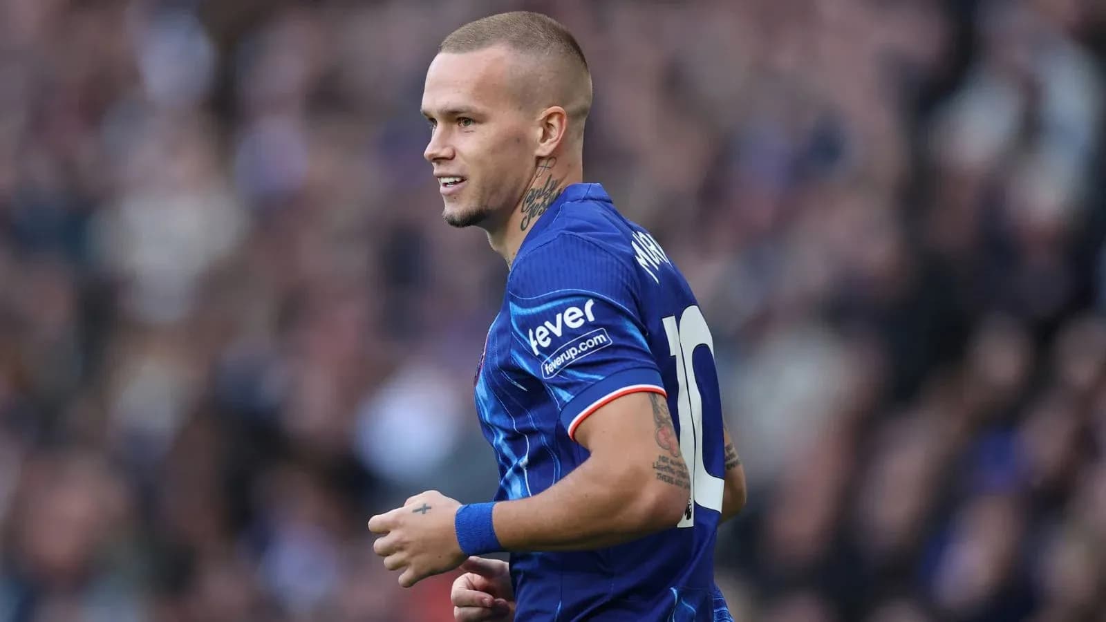Player in blue kit during match action
