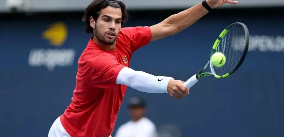 Player hitting a forehand during tennis practice
