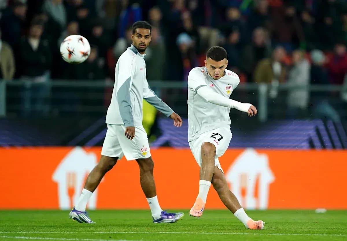 Player kicking a soccer ball during warm-up session