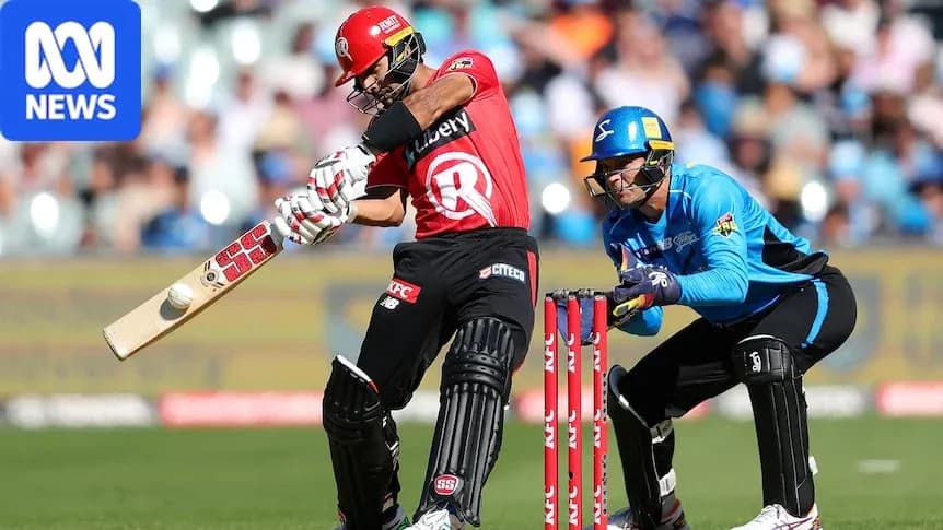 Batsman striking the ball while wicketkeeper crouches
