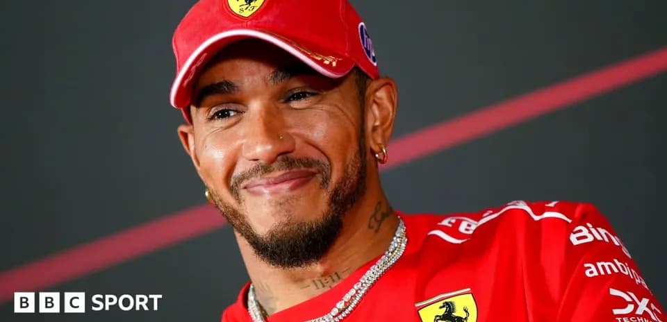 Driver wearing Ferrari cap and team shirt