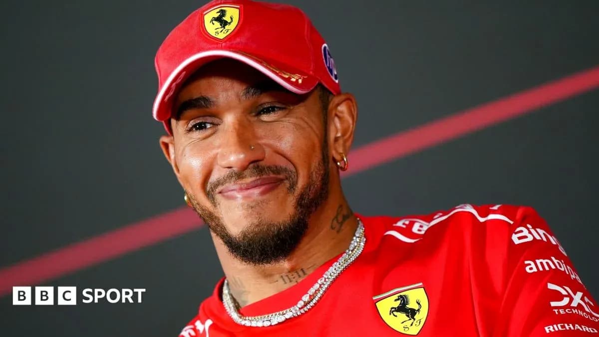 Driver wearing Ferrari cap and team shirt