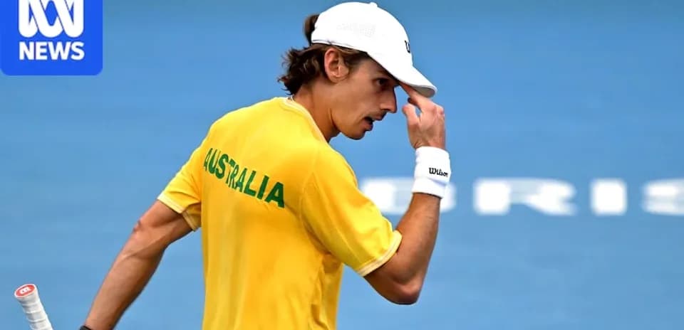 Tennis player in yellow Australia shirt during match