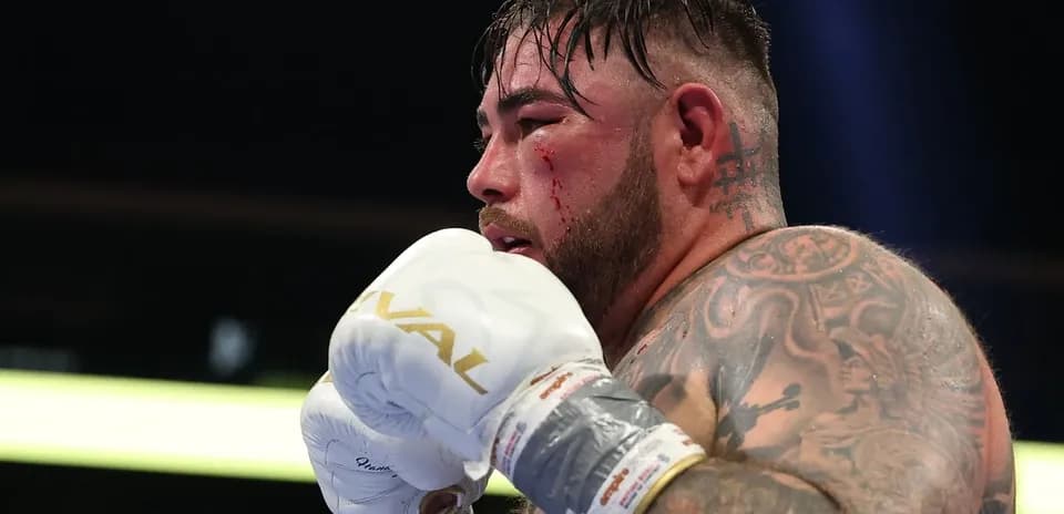 Boxer with blood on face during match