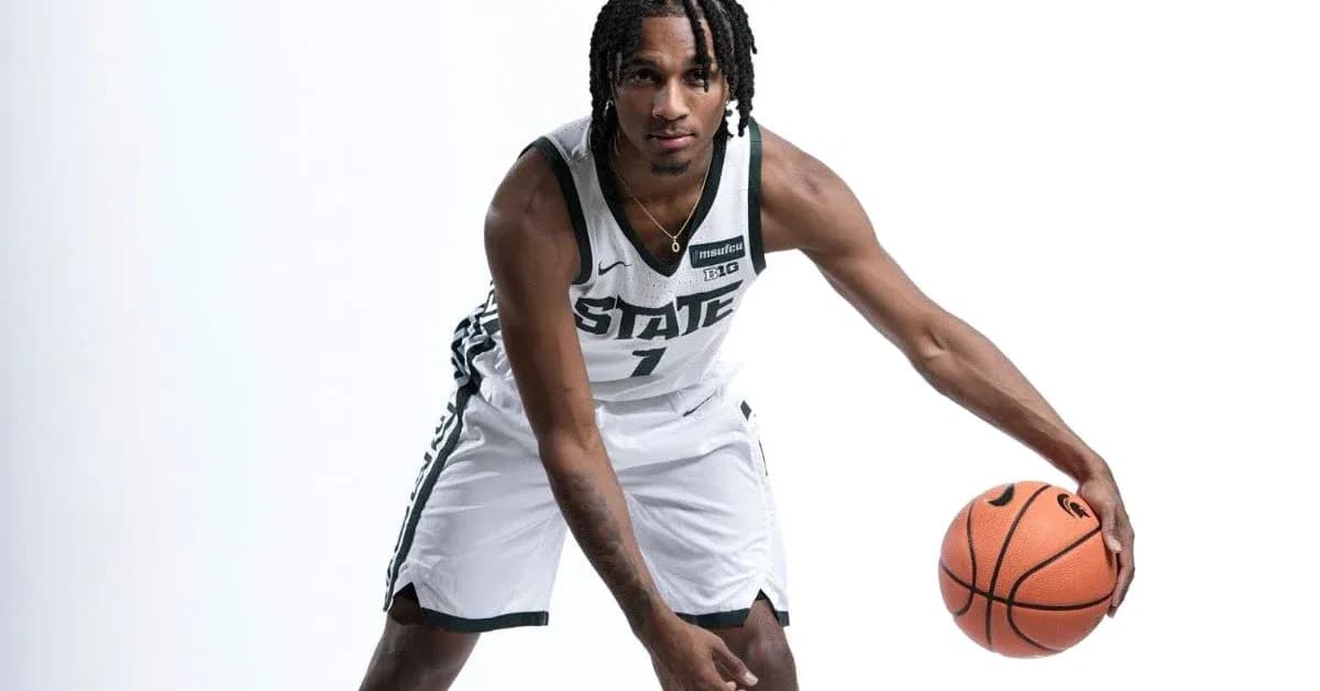 Basketball player dribbling a ball in uniform