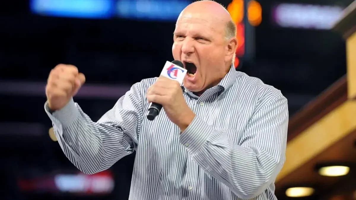 Man passionately speaking into a microphone at event