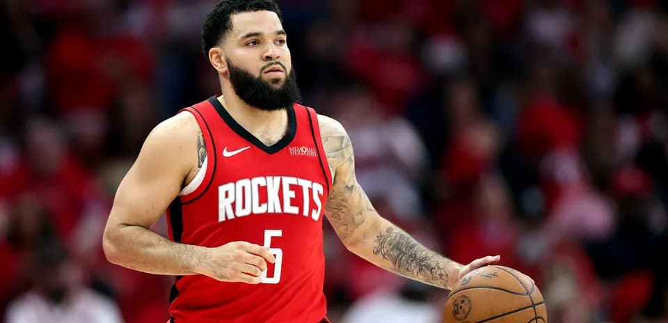 Player dribbling basketball in Houston Rockets uniform
