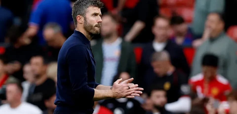 Manager gesturing during match at Old Trafford