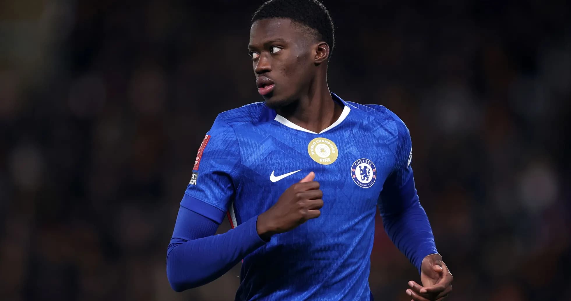 Chelsea player running during a football match