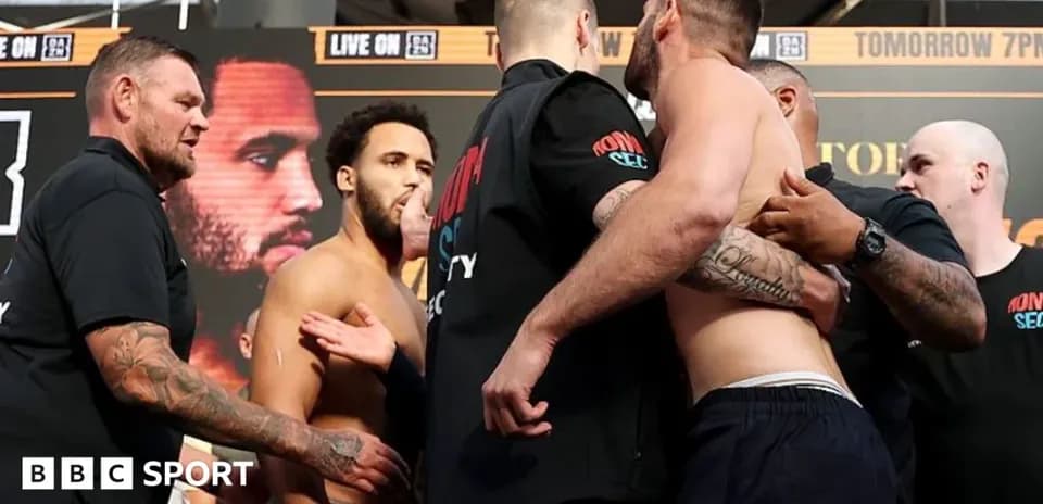 Two boxers facing off during weigh-in event