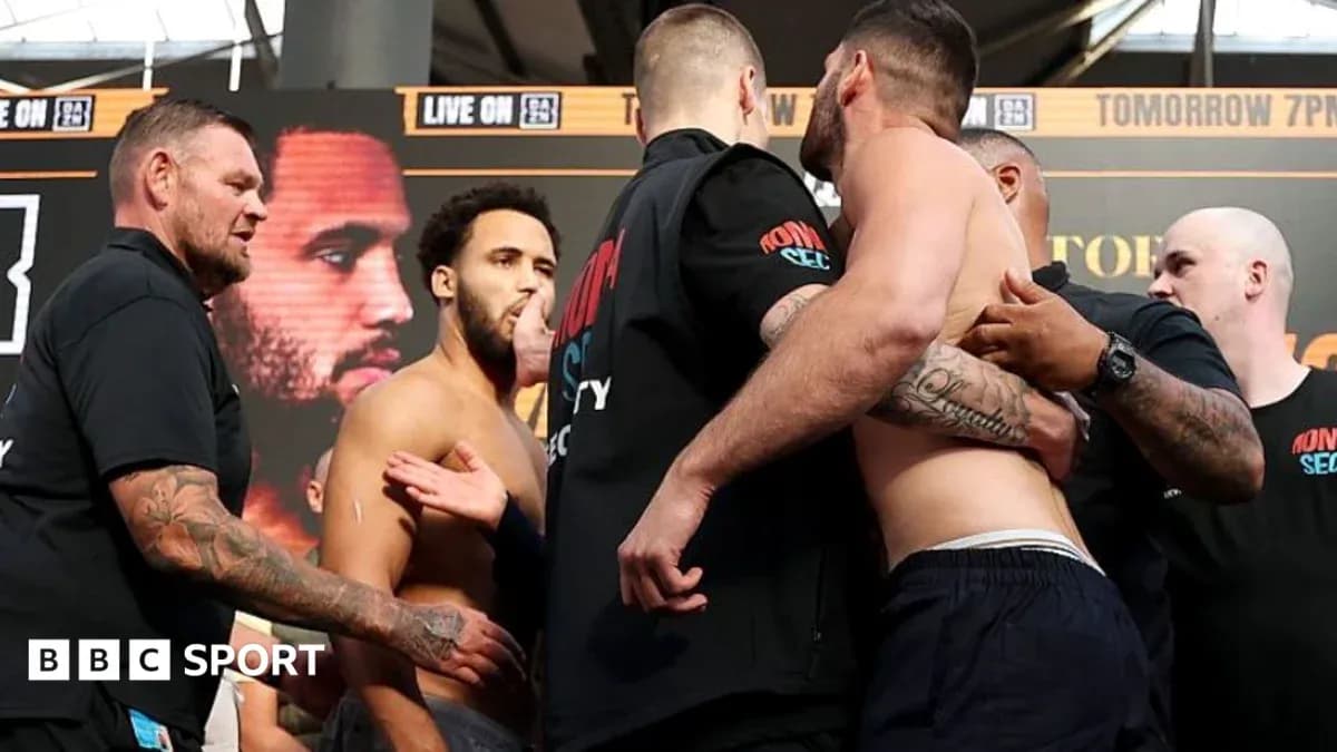 Two boxers facing off during weigh-in event