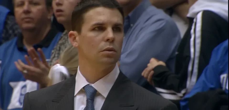 Coach observing the game from the sideline
