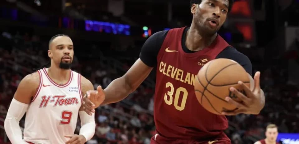 Cleveland player dribbling basketball during game