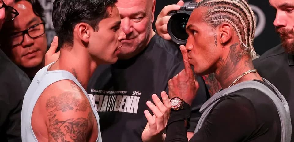 Two boxers facing off at weigh-in event