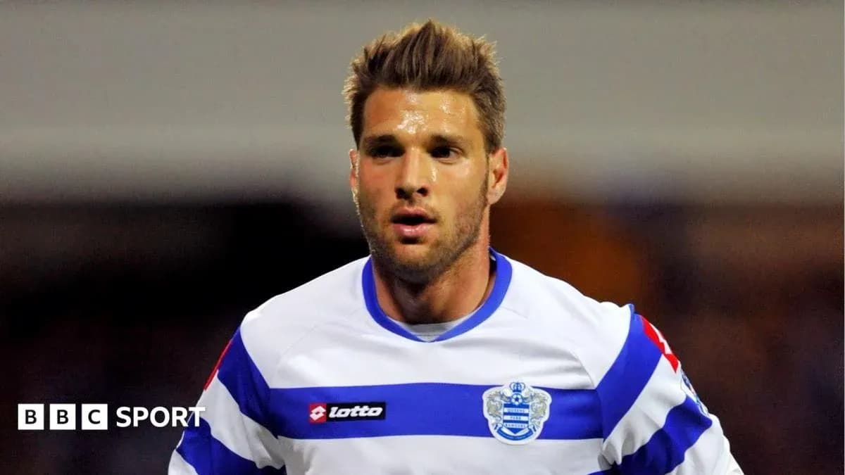 Player in QPR jersey during match action