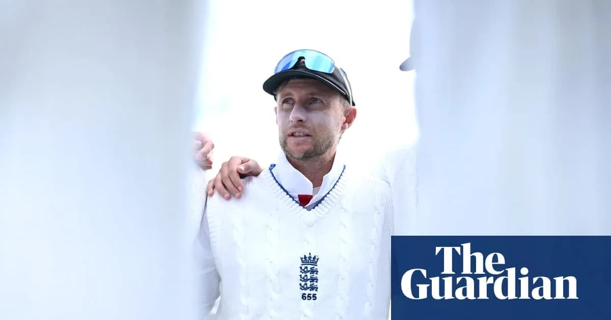 Cricketer in white sweater during team huddle