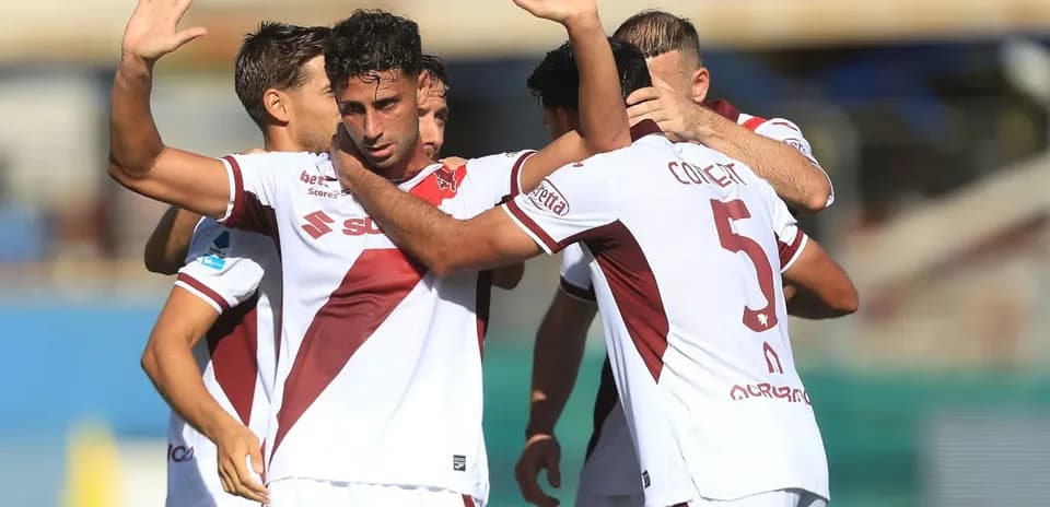 Players celebrating a goal on the field