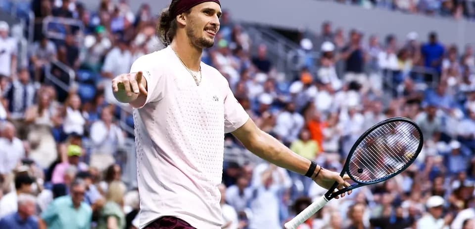 Tennis player gesturing during a match