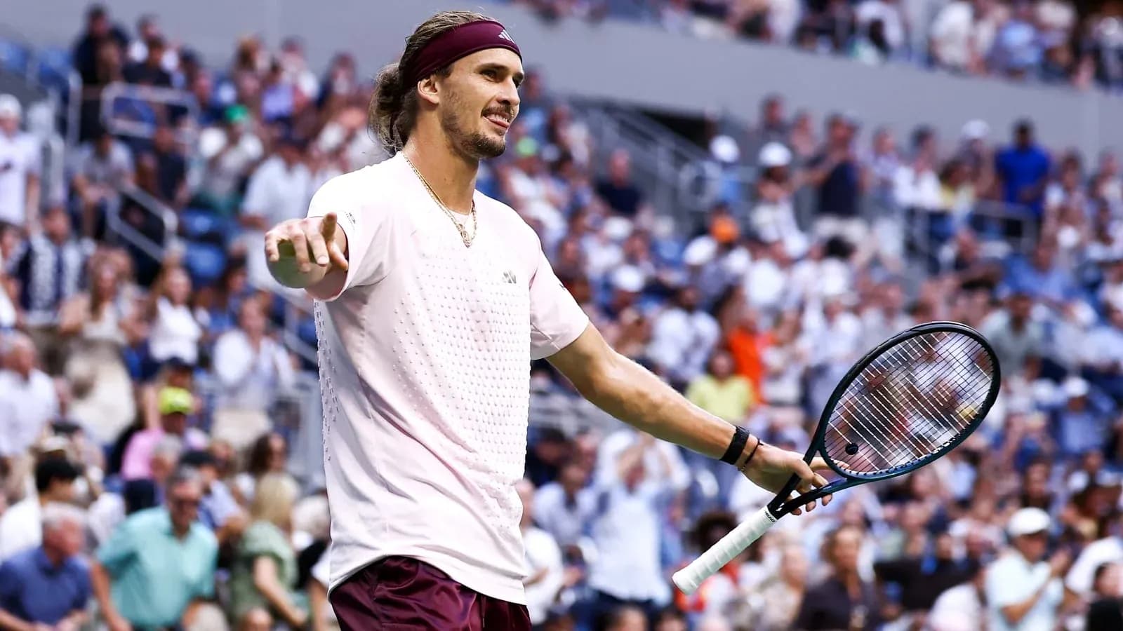 Tennis player gesturing during a match