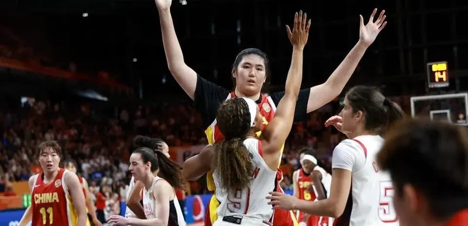 Players competing during a basketball game action