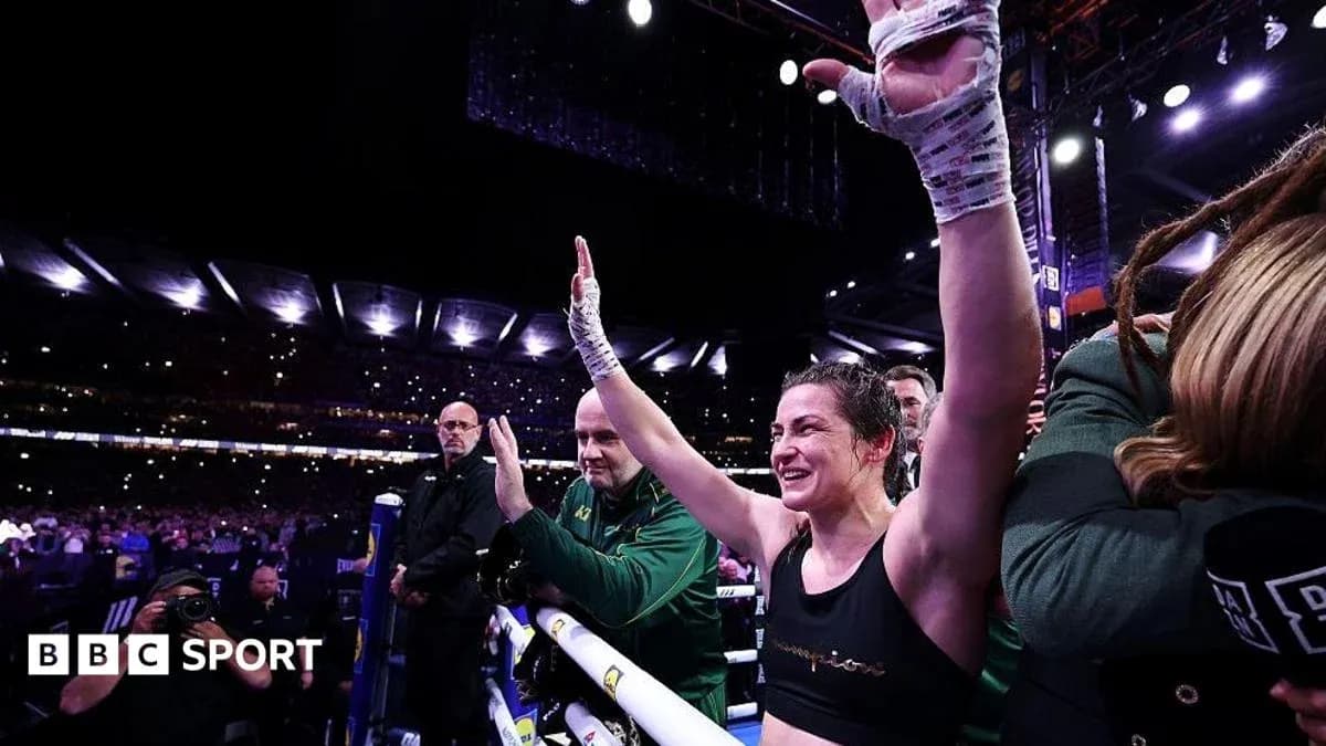 Female boxer celebrating in the ring after victory