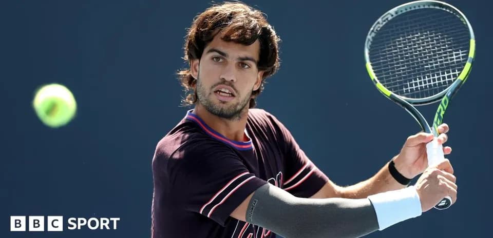 Player hitting a tennis ball during practice session