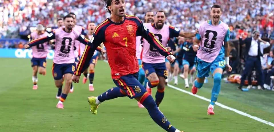 Player celebrating with teammates after scoring a goal