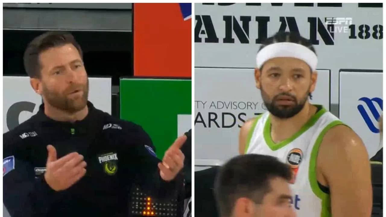 Coach gesturing while player looks on during game