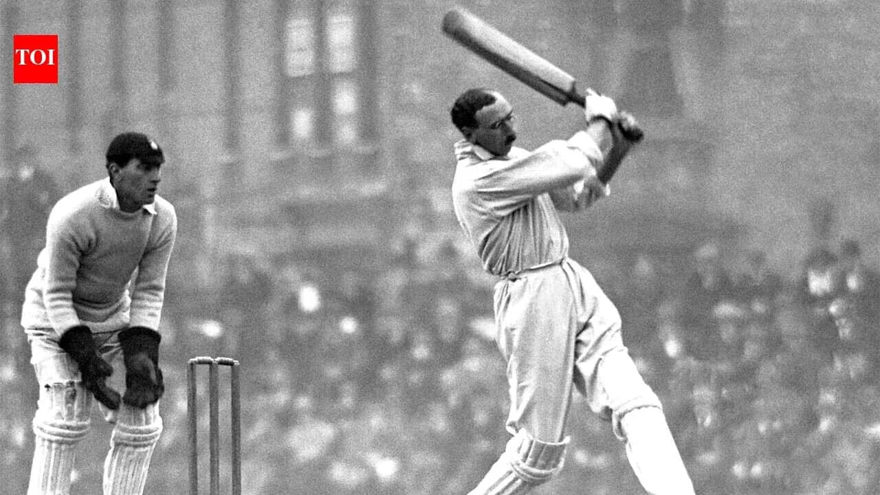 Batsman hitting ball with wicketkeeper behind