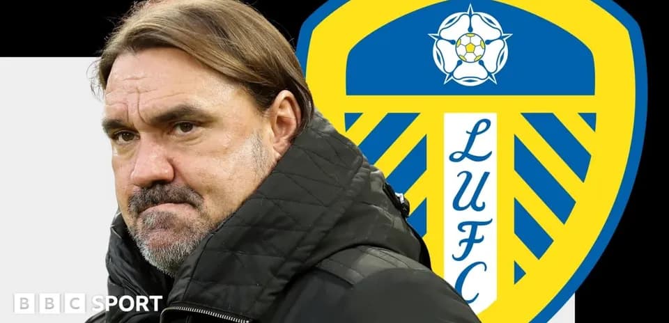 Coach with Leeds United logo in background