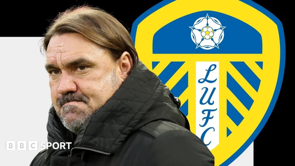 Coach with Leeds United logo in background