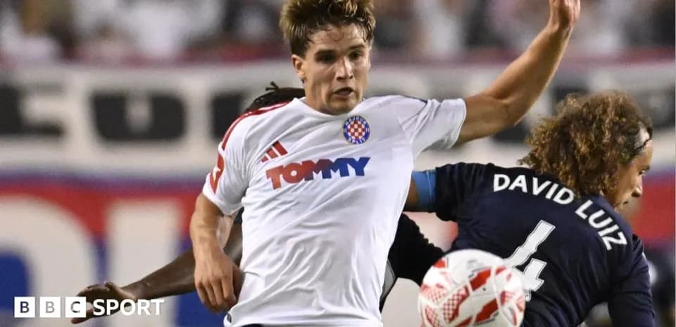 Player being challenged during a soccer match