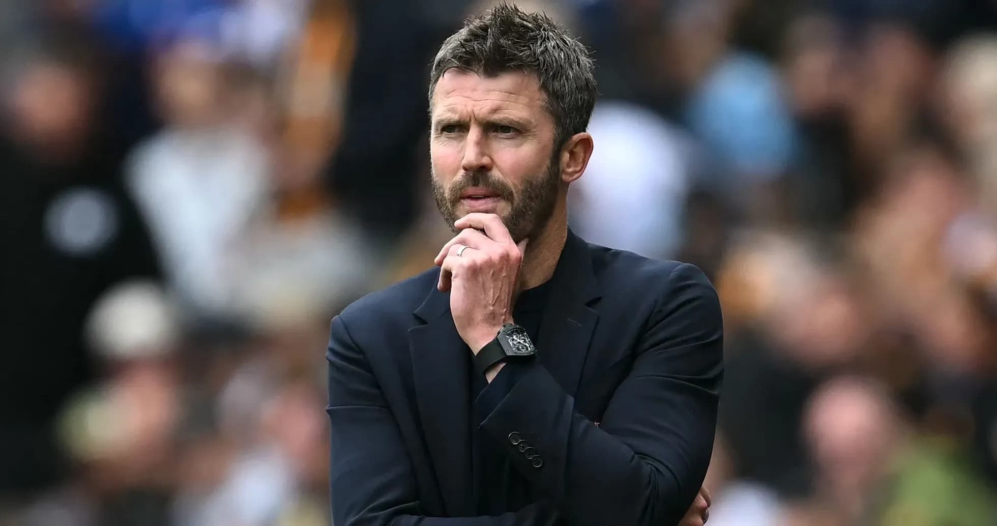 Manager contemplating during a football match