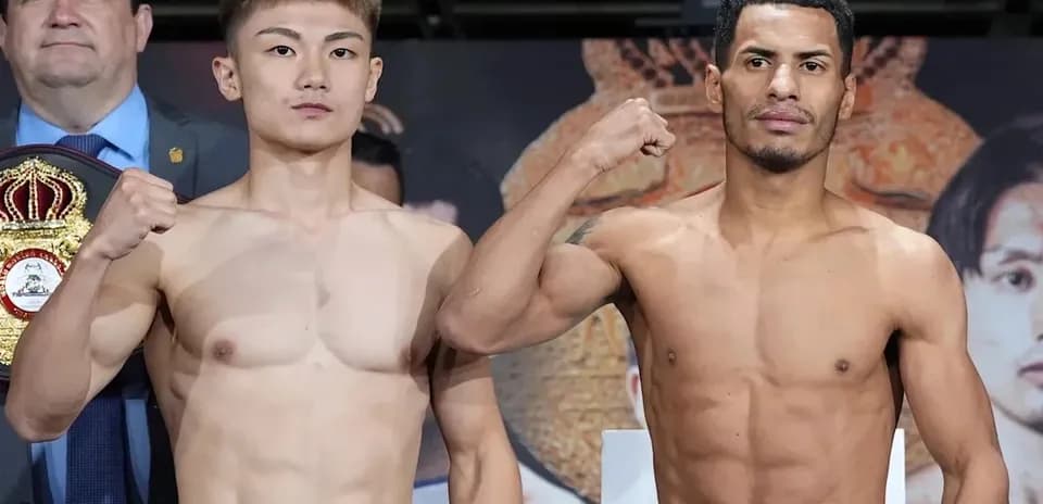 Two boxers posing at weigh-in event