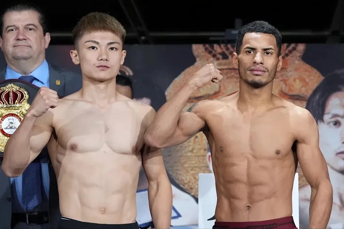 Two boxers posing at weigh-in event