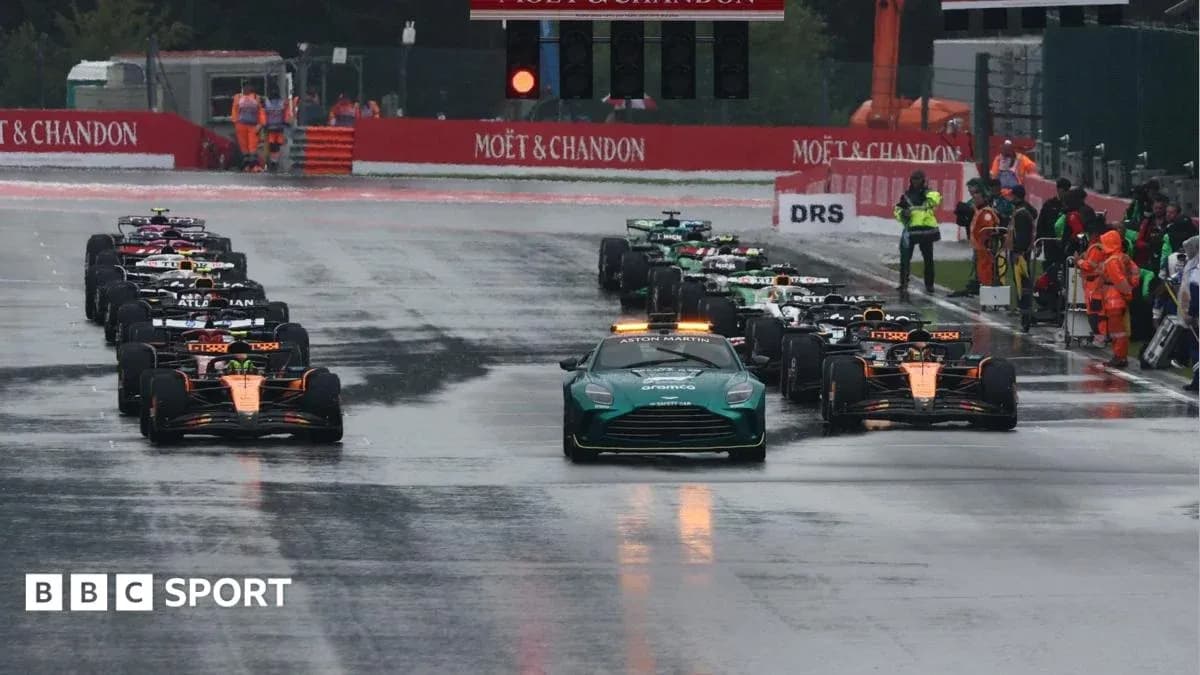 Cars lined up on wet track before race start