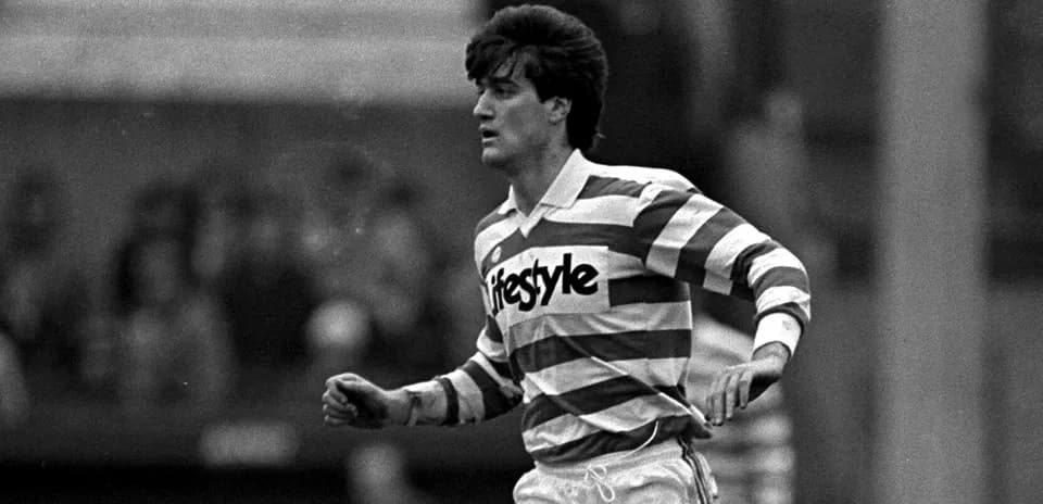 Player running in striped jersey during match