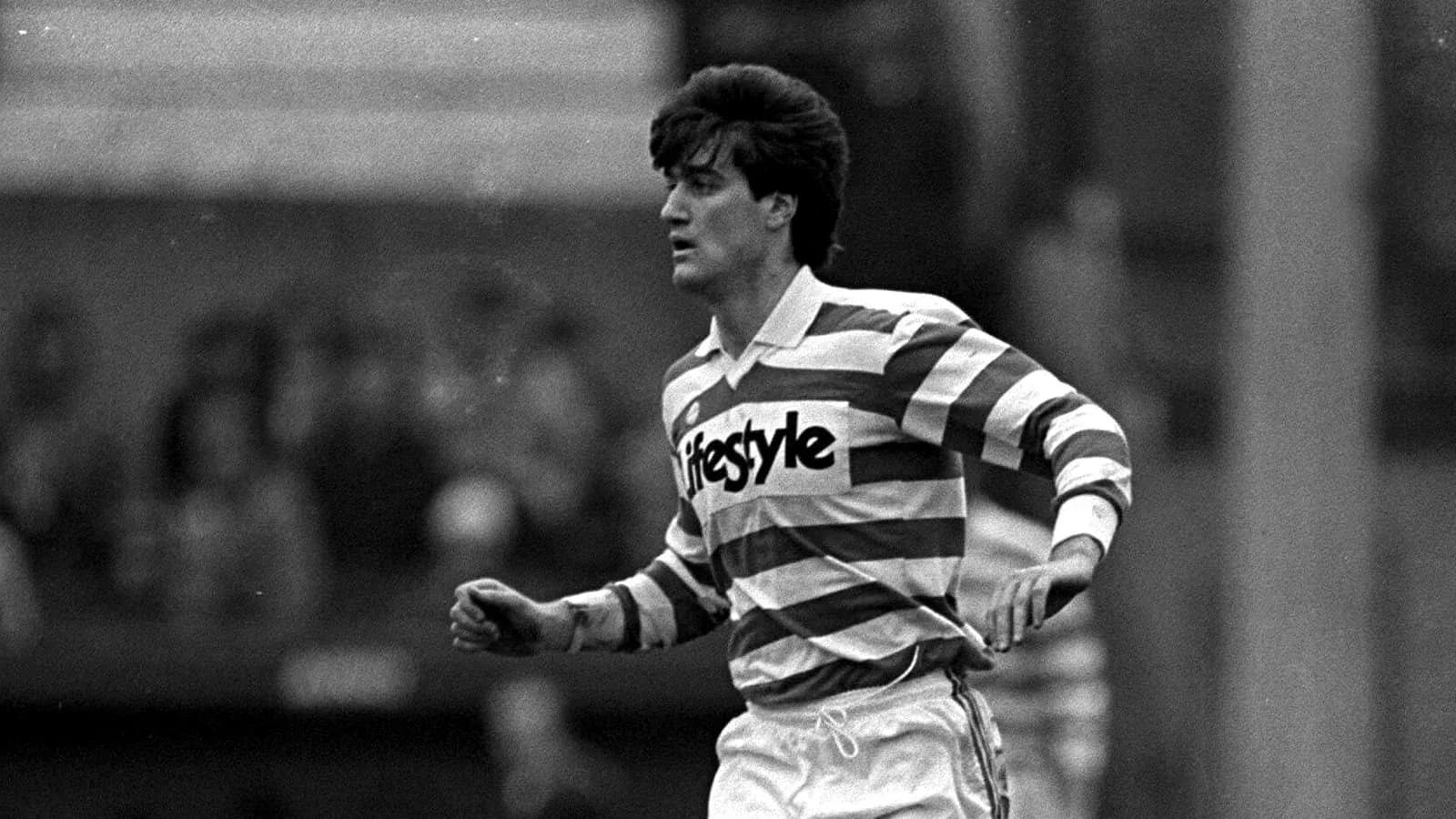 Player running in striped jersey during match