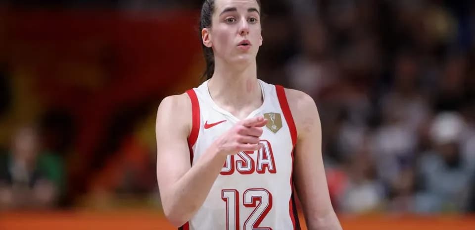 Player in USA jersey signaling during basketball game