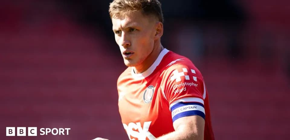 Player in red jersey wearing captain's armband